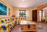 Vacation rental la hacienda condo 6  - living room sofa and TV